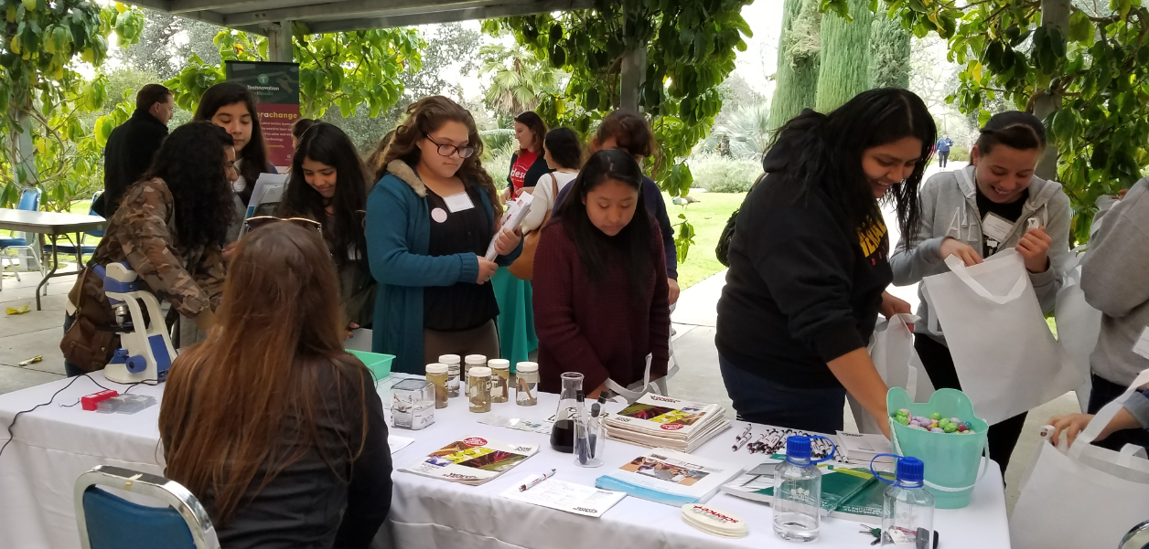 girls at a booth at the Los Angeles Country STEM Share Fair